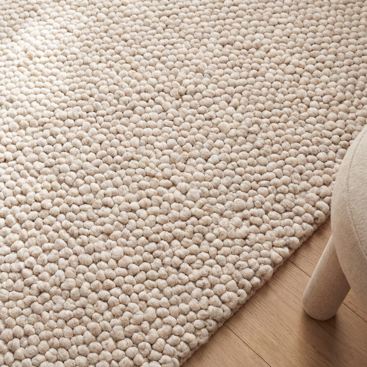 Translation missing: es.Handmade chunky wool rug in cream with thick loop pile, soft textured neutral boho area rug for cozy floors