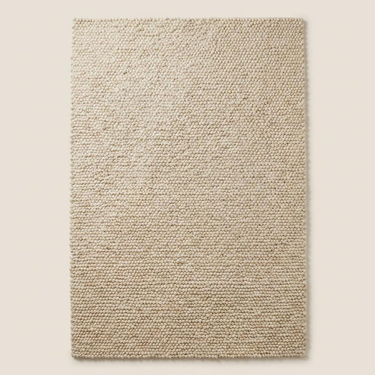 Translation missing: es.Thick woven cream wool rug for cozy bedroom or nursery with soft natural fiber texture