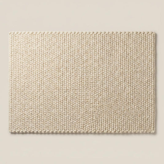 Translation missing: es.Thick cream wool area rug featuring textured pebble weave design, ideal for boho, Scandinavian, and organic modern home decor