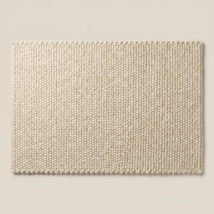 Translation missing: es.Thick cream wool area rug featuring textured pebble weave design, ideal for boho, Scandinavian, and organic modern home decor