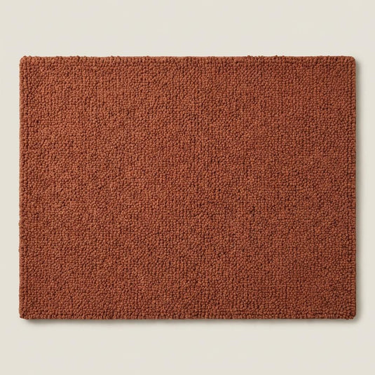 Translation missing: es.Top-down view of solid rust textured rug highlighting loop construction