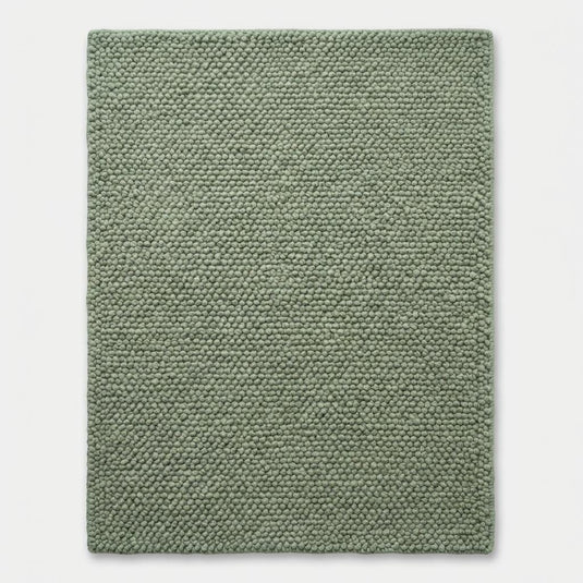 Translation missing: es.Chunky wool textured sage green area rug with thick looped plush surface for cozy modern organic interiors