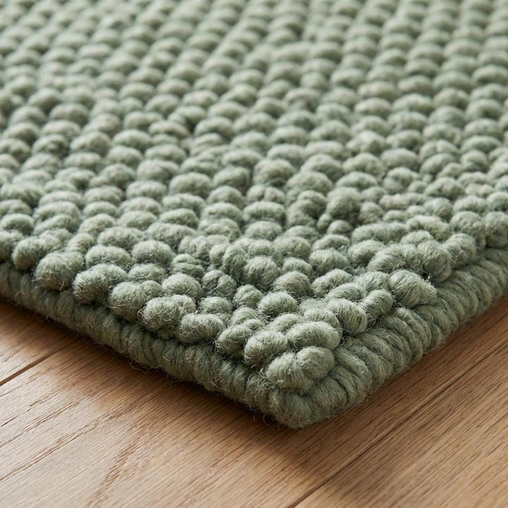Translation missing: fr.Chunky wool textured sage green area rug with thick looped surface and cozy plush feel