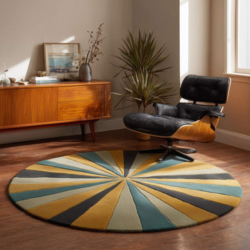 Translation missing: es.Hand tufted round geometric rug with starburst pattern in mustard, teal, and charcoal tones crafted from premium New Zealand wool