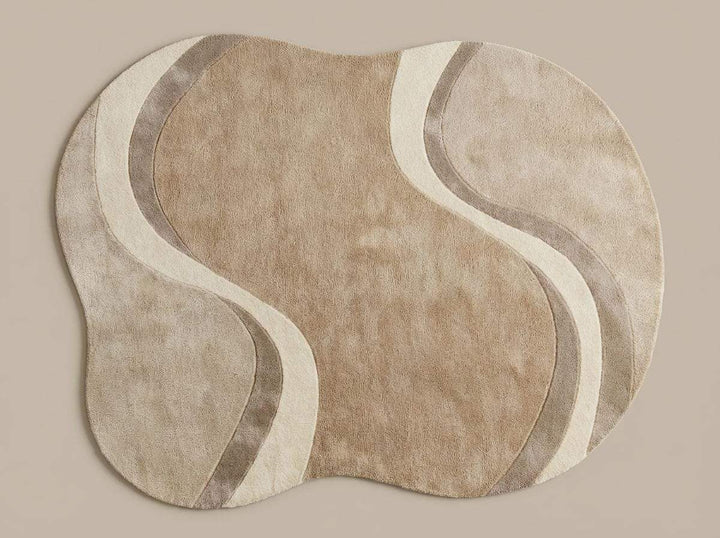 Translation missing: en.Modern curved rug living room with wavy abstract pattern in beige, cream, and taupe organic shape