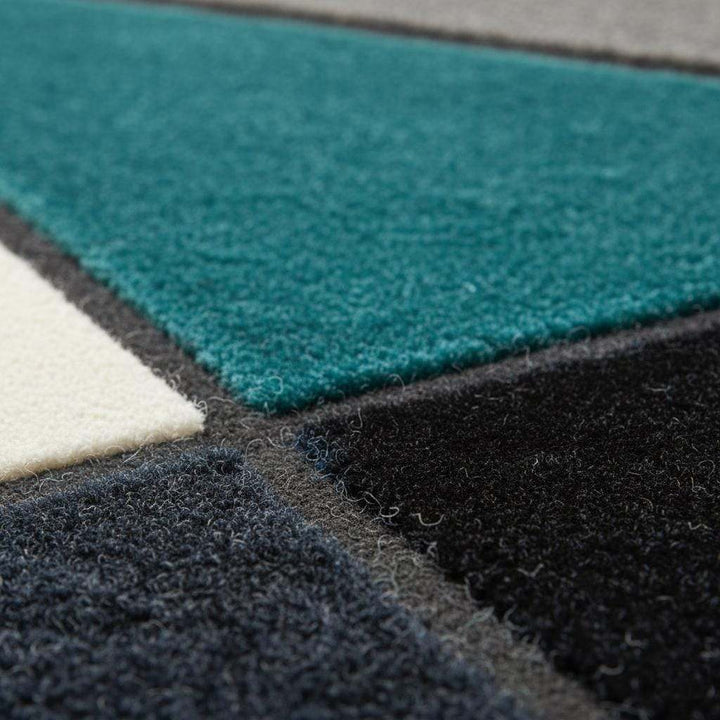 Translation missing: en.Deep teal area rug with hand tufted plush geometric design and durable poly-blend fibers