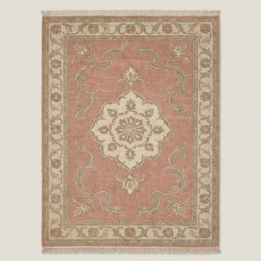 Translation missing: es.Floral hand knotted rug styled in living room with wooden floor and neutral furniture