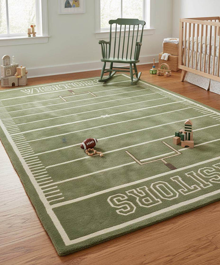 Translation missing: es.Green football area rug with ivory field lines and subtle brown accents