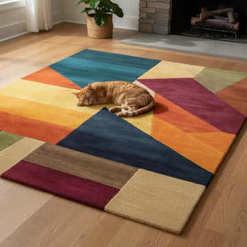 Translation missing: fr.Colorful geometric area rug with triangle patchwork pattern in vibrant teal, navy, gold, orange, green, and burgundy tones