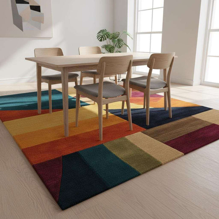 Translation missing: en.Colorful geometric area rug with triangle patchwork pattern and plush wool blend texture