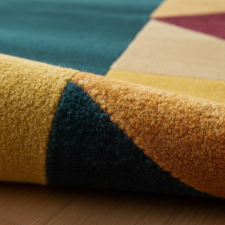 Translation missing: en.Colorful geometric area rug with triangle patchwork pattern and plush wool blend texture