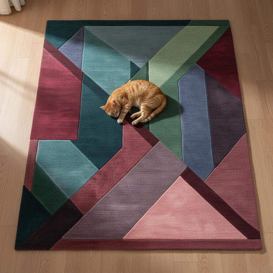 Translation missing: es.Geometric area rug with triangles in burgundy, green, teal, blush pink, and plum jewel tones