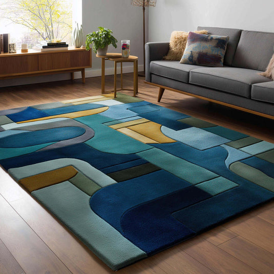 Translation missing: es.Mid-century modern geometric block area rug in navy, teal, gold, and olive colors with abstract patterns