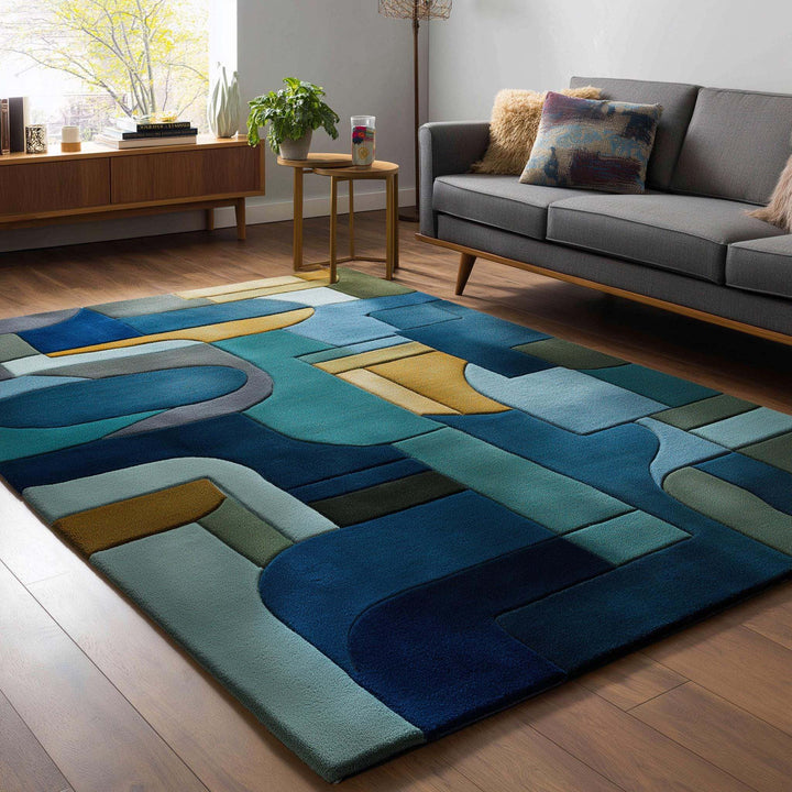Translation missing: en.Mid-century modern geometric block area rug in navy, teal, gold, and olive colors with abstract patterns