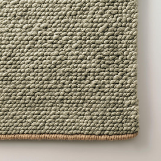 Translation missing: es.Green chunky wool rug with handwoven pebble texture in natural sage tone