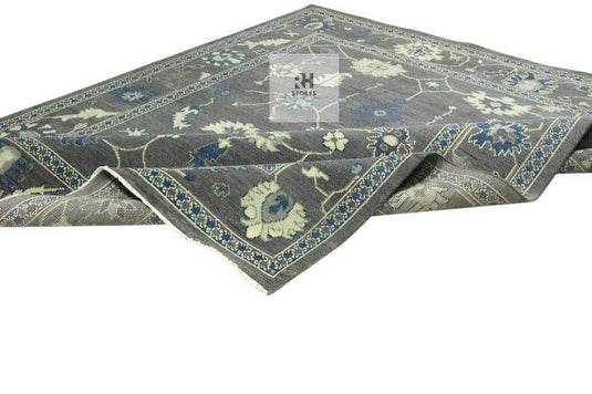 Translation missing: es.Hand Knotted Oushak Wool Rug with traditional floral design in muted gray, peachy orange, blue, green, and cream tones, 8x10 area rug