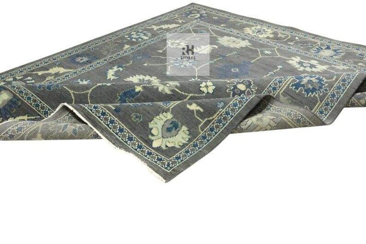 Translation missing: es.Hand Knotted Oushak Wool Rug with traditional floral design in muted gray, peachy orange, blue, green, and cream tones, 8x10 area rug