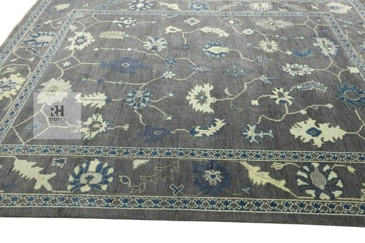 Translation missing: es.Hand knotted Oushak wool rug with traditional floral design in muted gray and peachy orange, 8x10 area rug