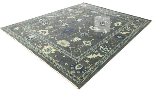 Translation missing: es.Hand knotted Oushak wool rug with traditional floral design in muted gray, peach, blue, and green, 8x10 area rug