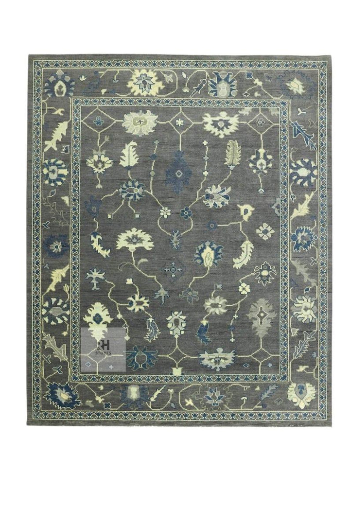 Translation missing: es.Hand knotted Oushak wool rug with traditional floral design in muted gray and soft peachy hues, 8x10 area rug