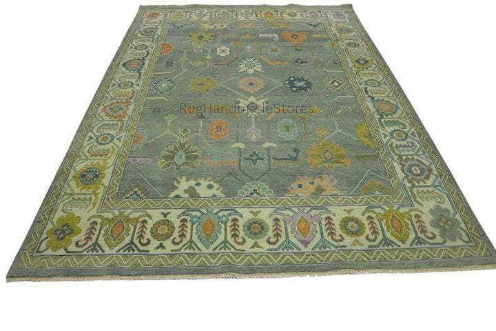 Translation missing: es.Hand-knotted vintage Oushak wool rug with intricate floral Turkish design in green and blueish-green tones for living room decor