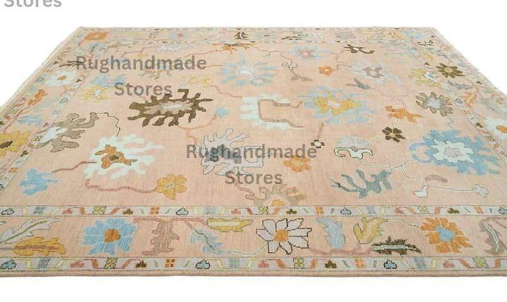 Translation missing: es.Hand-knotted Oushak wool rug with vintage floral design in light pink, dark brown, and purple accents for living room decor