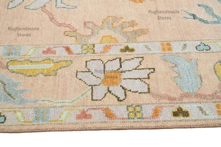 Translation missing: es.Hand-knotted Oushak wool rug in light pink and dark brown with purple accents, vintage Turkish design for living room decor