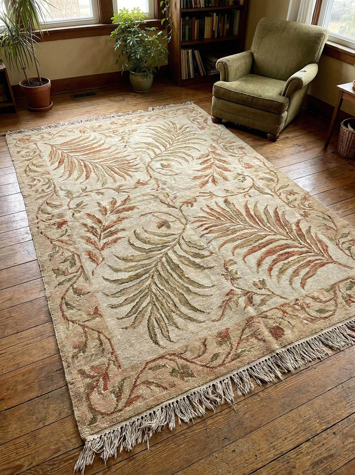 Translation missing: en.Hand-knotted wool area rug with sage green botanical pattern and natural wool texture