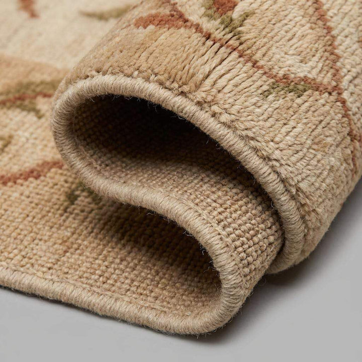 Translation missing: en.Close-up of the hand-knotted wool texture showing the individual yarn twists, dense pile, and authentic artisan weave structure with no synthetic backing