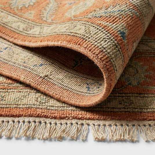 Translation missing: en.Close-up of the hand-knotted wool pile showing the individual knot structure, natural fiber variations, and soft, dense weave texture