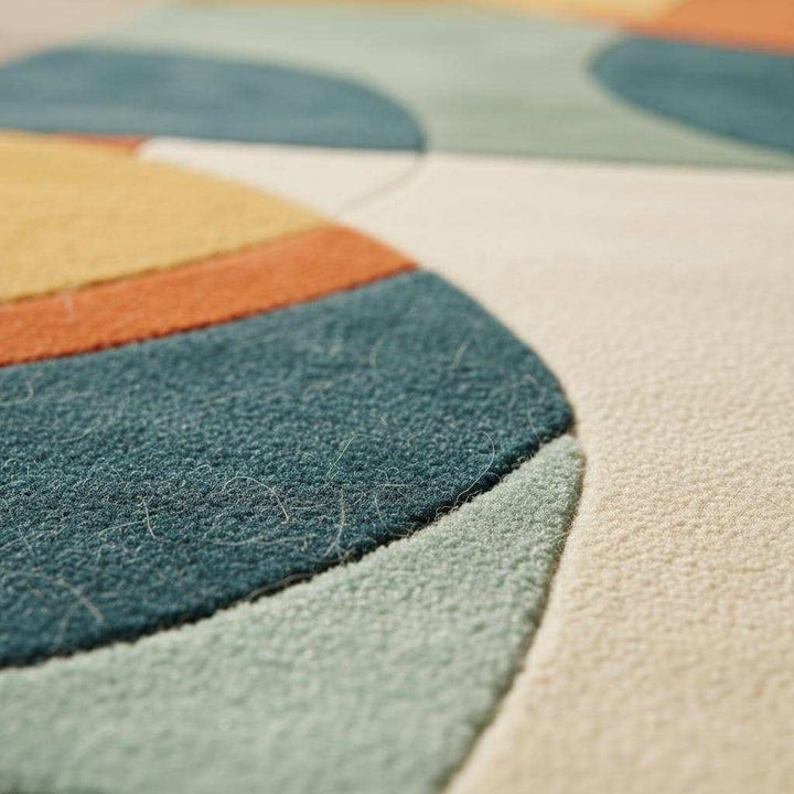 Translation missing: en.Hand tufted geometric area rug with burnt orange, teal, mustard gold, and sage tones in mid-century modern style