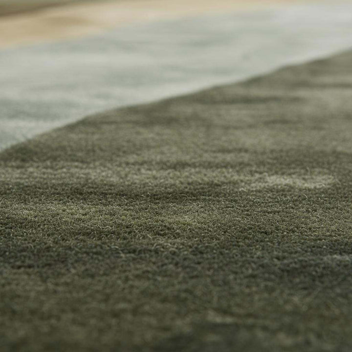 Translation missing: en.Hand tufted wool rug with abstract landscape design in earthy green tones for modern Scandinavian and Japandi interiors