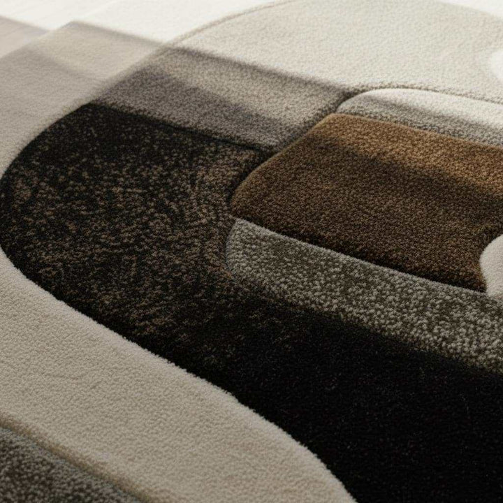 Translation missing: en.Hand tufted wool rug with abstract geometric black and ivory design and plush textured pile
