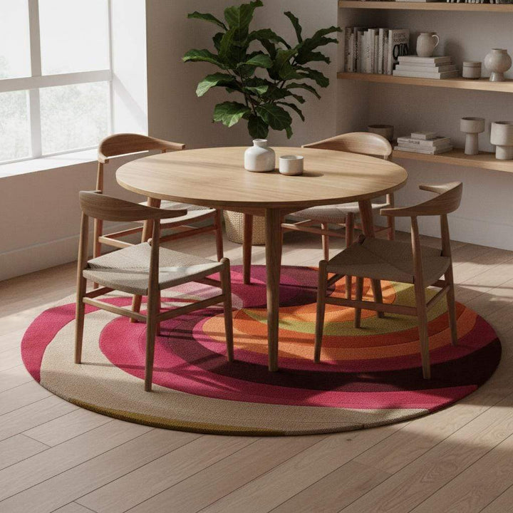 Translation missing: es.Retro swirl round rug — vibrant pink and orange wool rug for eclectic decor, pairs with velvet seating and indoor plants