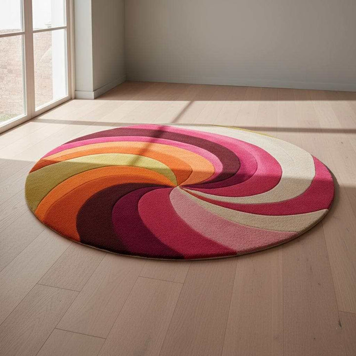 Translation missing: es.Handcrafted circular wool rug with bold spiral motif, modern boho and 70s inspired color palette — perfect housewarming gift