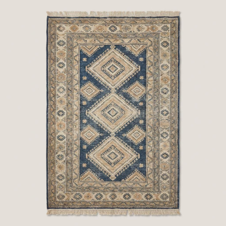 Translation missing: en.Traditional blue and ivory hand knotted rug with diamond geometric pattern and artisan detailing