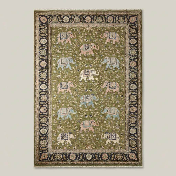 Translation missing: en.Traditional elephant pattern rug with navy ornamental border on wooden floor interior