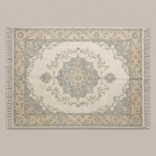 Translation missing: es.Persian style hand knotted rug featuring floral vines in blush, sage, and muted blue tones