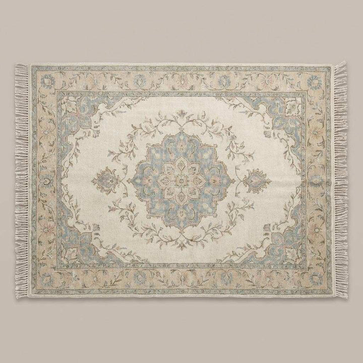 Translation missing: es.Persian style hand knotted rug featuring floral vines in blush, sage, and muted blue tones