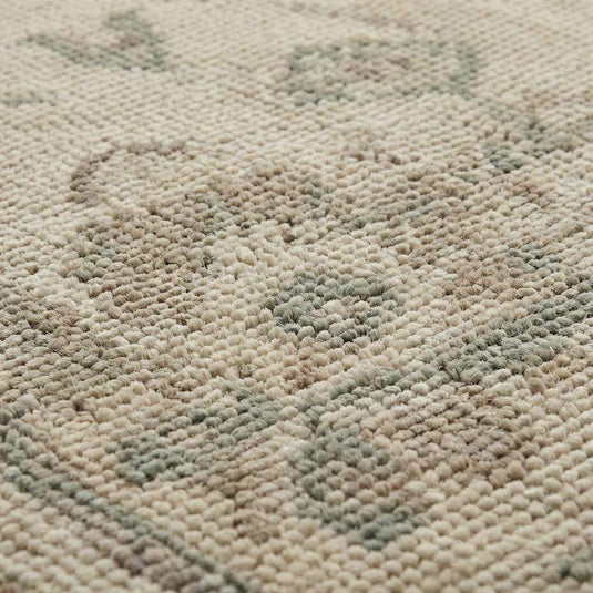 Translation missing: en.Close up of hand knotted wool rug showing low pile texture and individual knot structure