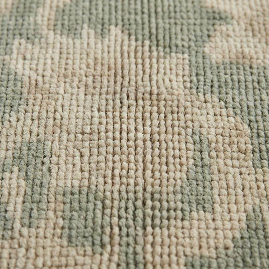 Translation missing: en.Close up of hand knotted wool pile showing individual knots and natural fiber texture