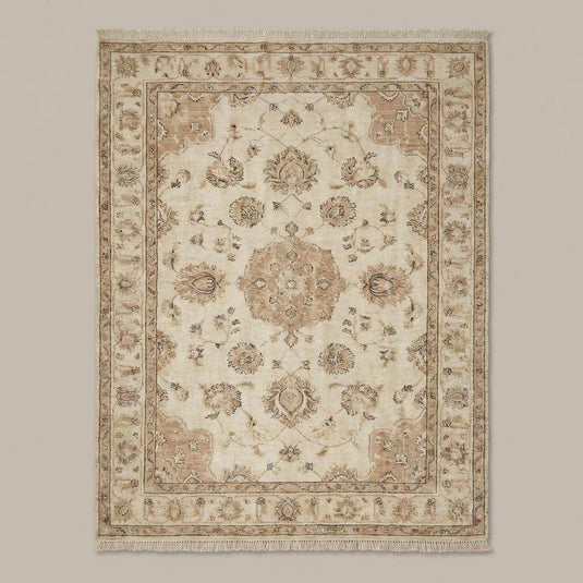 Translation missing: fr.Neutral beige area rug styled in a transitional living room with linen furniture and vintage decor
