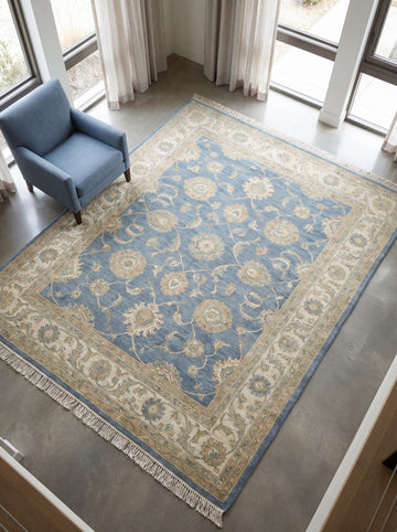 Translation missing: es.Hand knotted blue Oushak rug with floral pattern placed in a modern living room setting __etsy:8030552737
