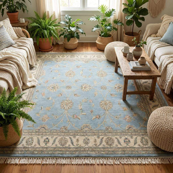 Translation missing: es.Blue and beige wool rug placed on wooden floor with blue armchair showing scale and color