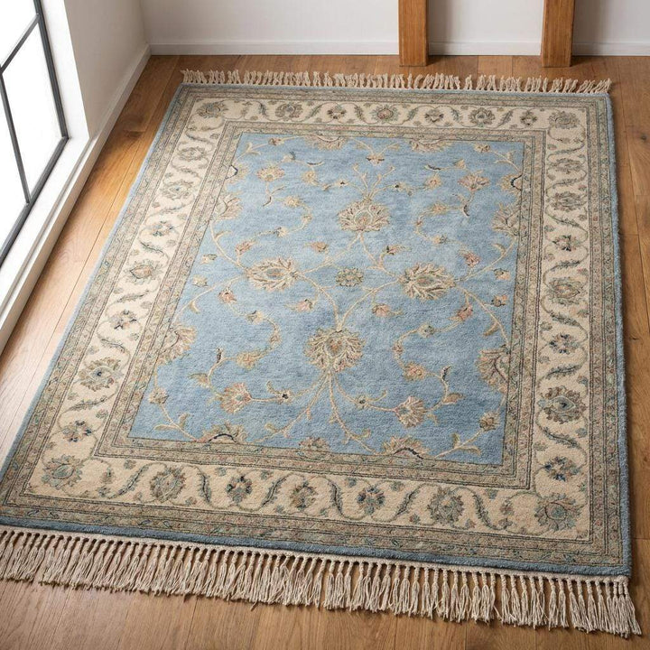 Translation missing: es.Soft muted blue rug styling for coastal or farmhouse living room decor