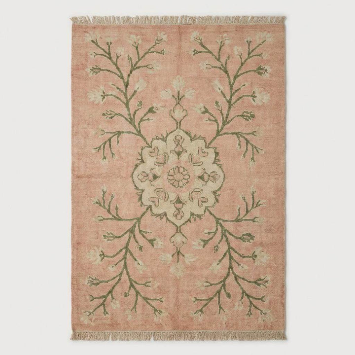 Translation missing: es.Blush pink floral wool area rug with sage green vine motifs and antique inspired pattern