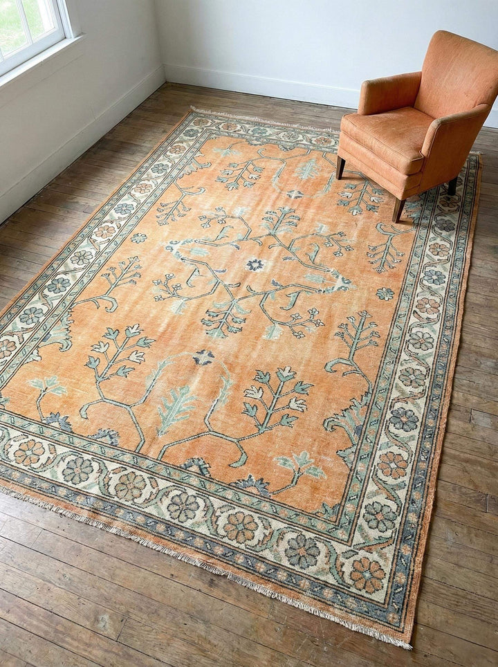 Translation missing: fr.Hand knotted Oushak rug with muted apricot and sage green vintage floral design, handmade wool area rug for boho living room decor
