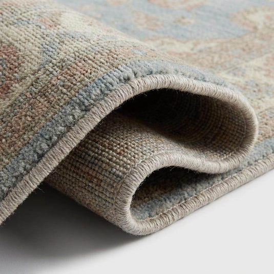 Translation missing: en.Close up detail of hand knotted wool pile showing individual knots and soft texture without latex backing