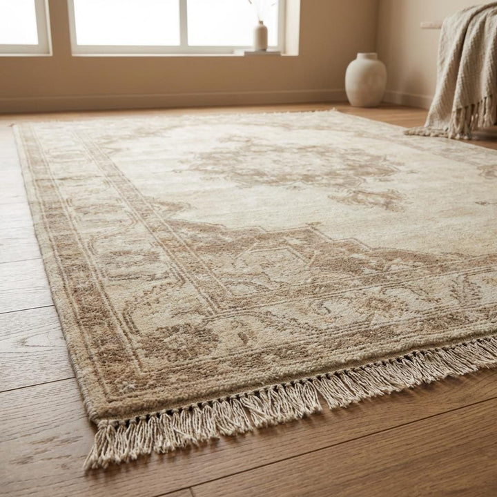 Translation missing: en.Authentic artisan hand knotted wool carpet with subtle faded pattern and warm earth-tone palette