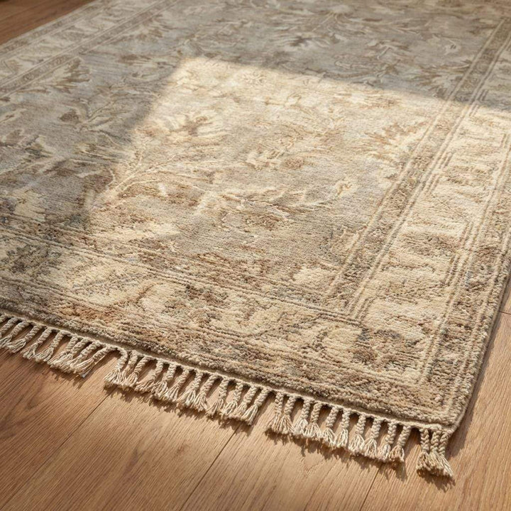 Translation missing: en.Close-up of dense hand knotted wool pile showing individual knots, natural fiber texture, and subtle tonal variation in beige and taupe